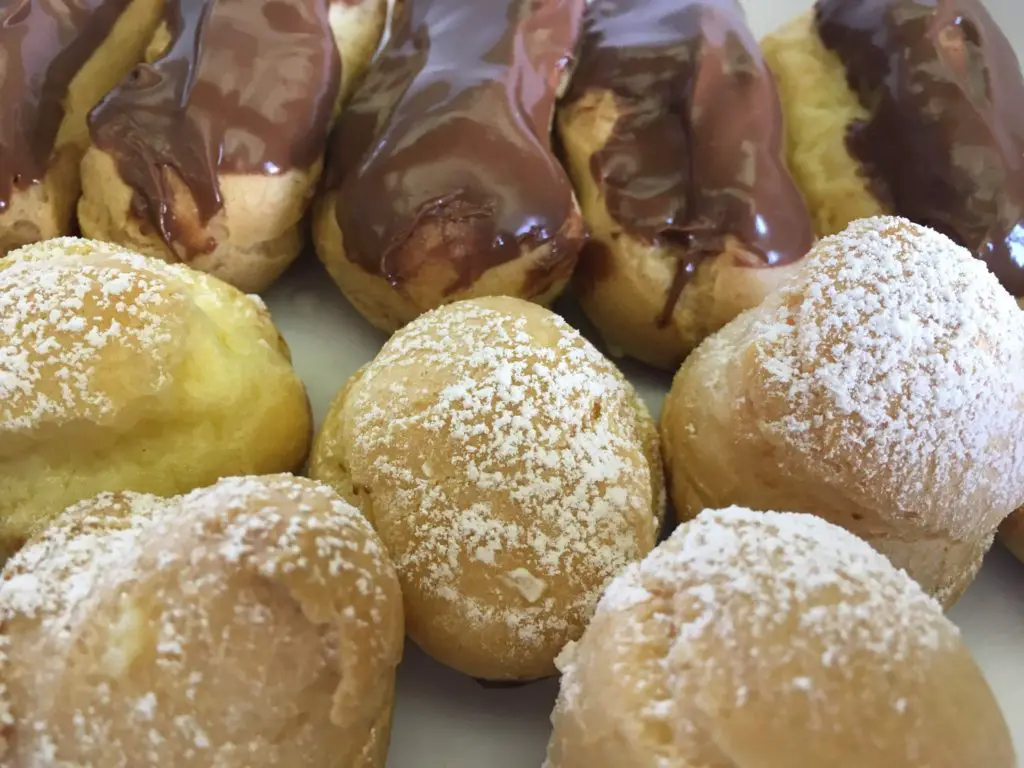chocolate eclairs and cream puffs with vanilla pastry cream made from scratch