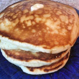 butter melting on pancake stack