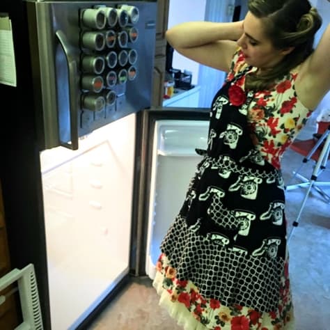 fixing my hair while cleaning the fridge