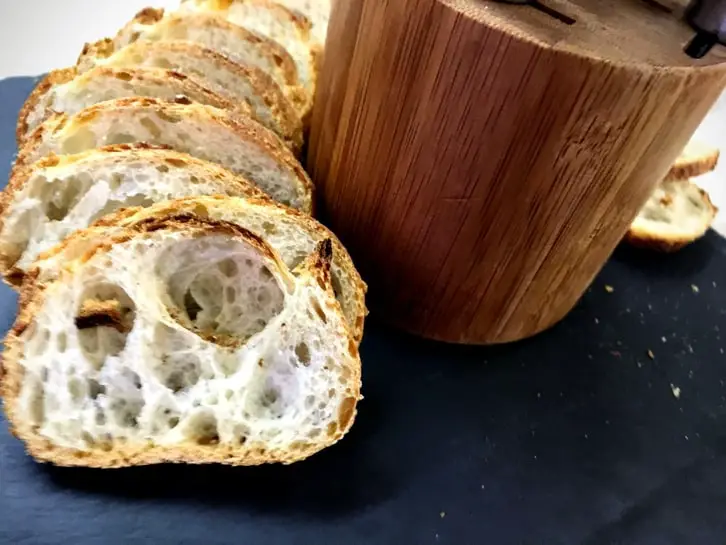 sliced baguette rounds on a cheese board