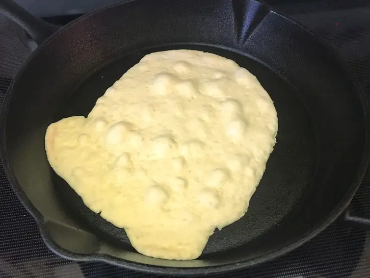 naan in a cast iron skillet