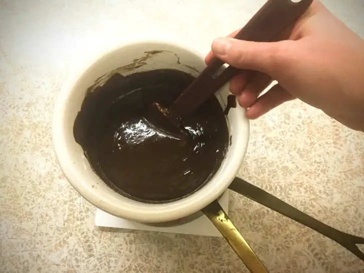 stirring dark chocolate ganache