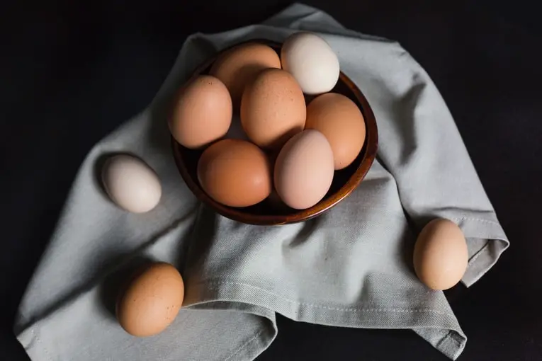 rustic bowl of brown eggs