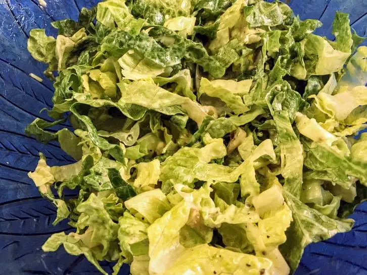 romaine lettuce tossed in homemade Caesar salad dressing