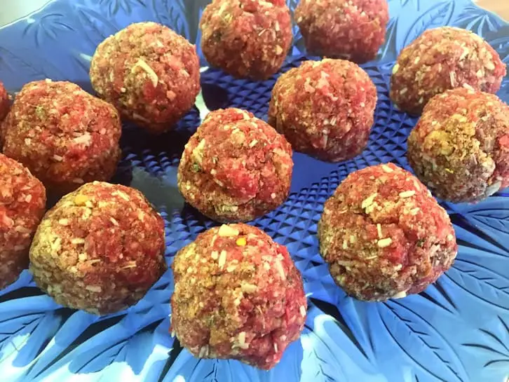 platter of raw homemade meatballs