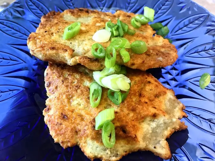 plate of german potato pancakes Kartoffelpfannkuchen