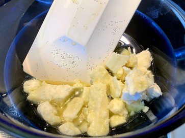 melting shea butter with vanilla infused olive oil