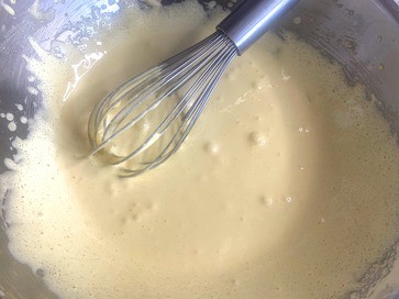 whisking sugar and eggs for ice cream